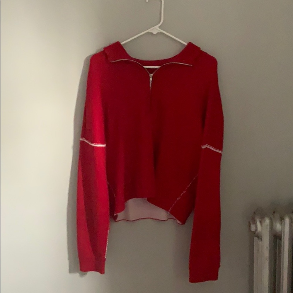 Slightly cropped red sweater